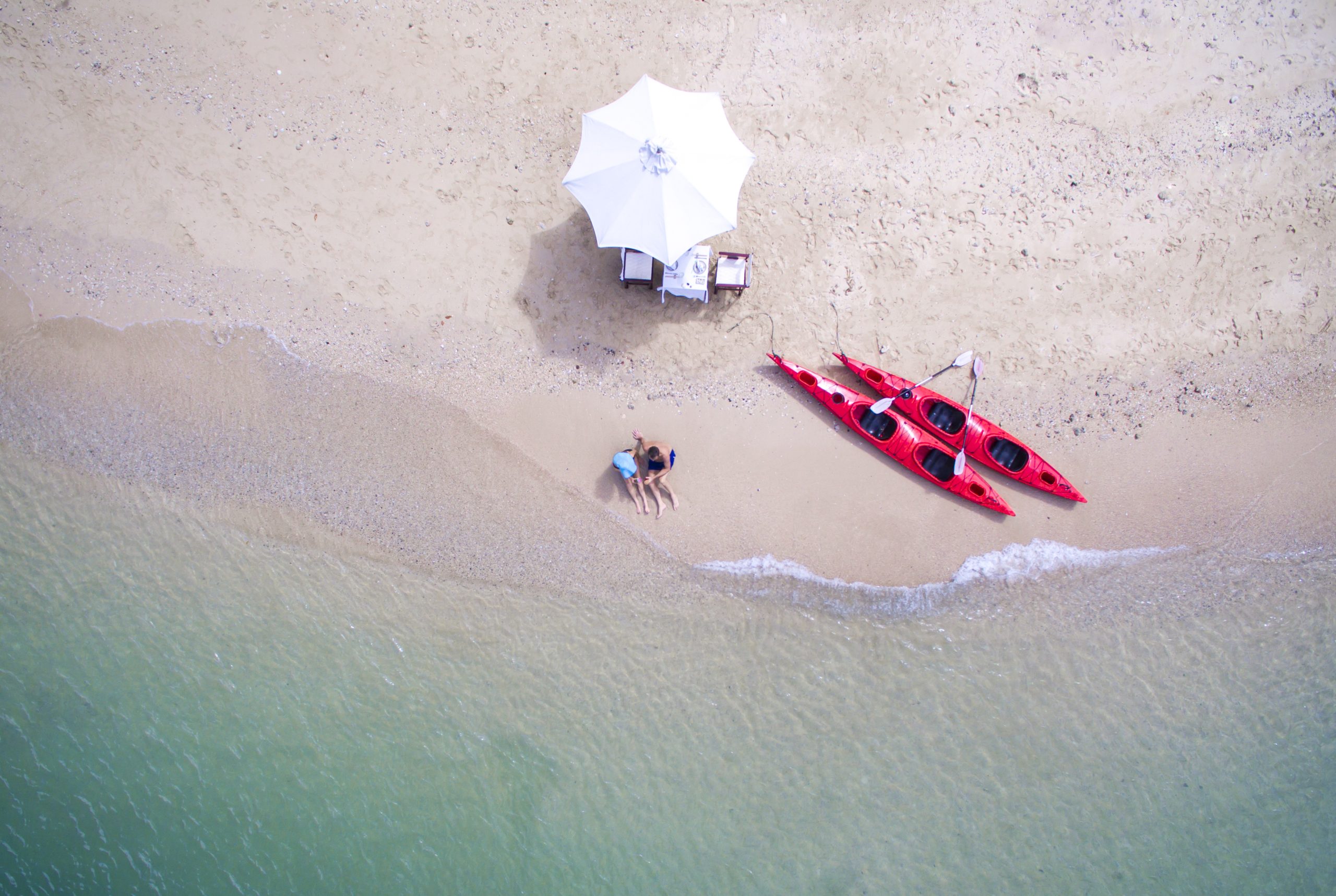 Guests on a private beach of Bai Tu Long Bay 